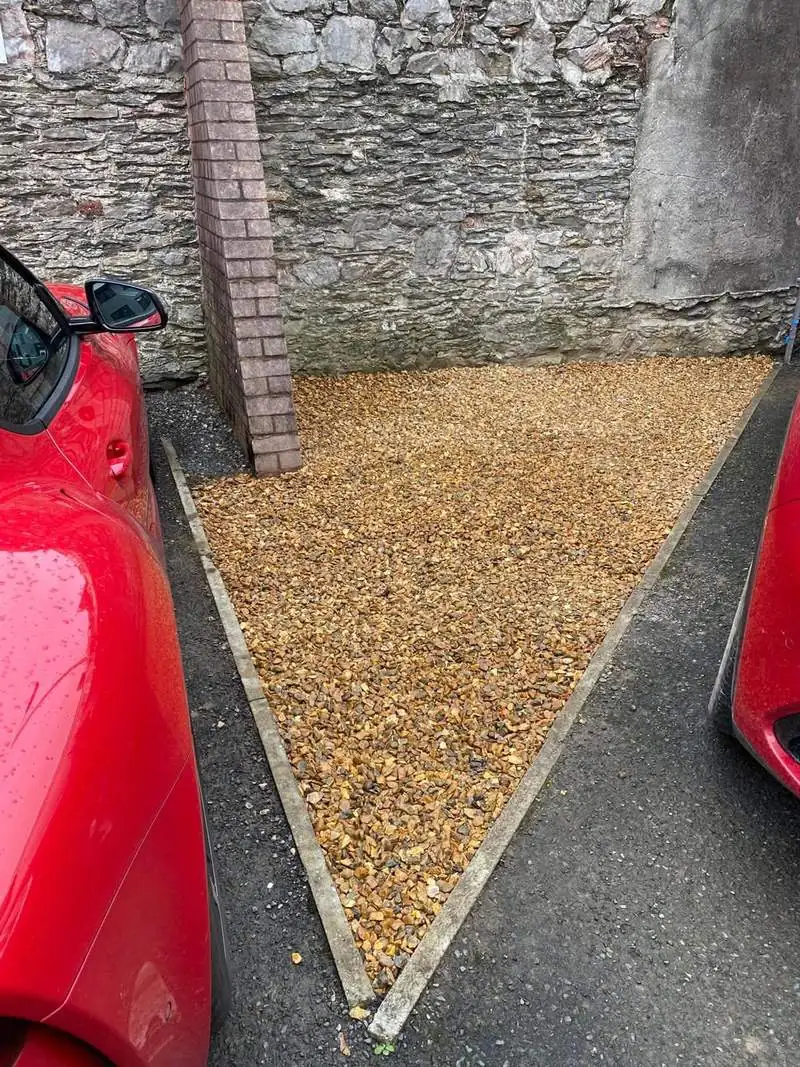 The same area cleared, levelled and topped with fresh golden gravel